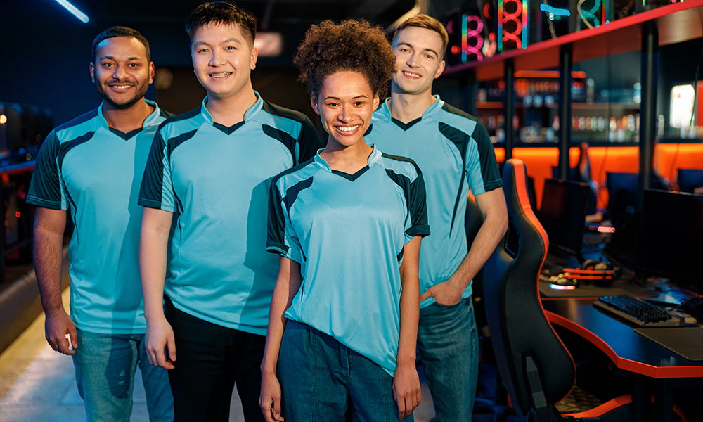 female gamer stands with her teammates in cyber club