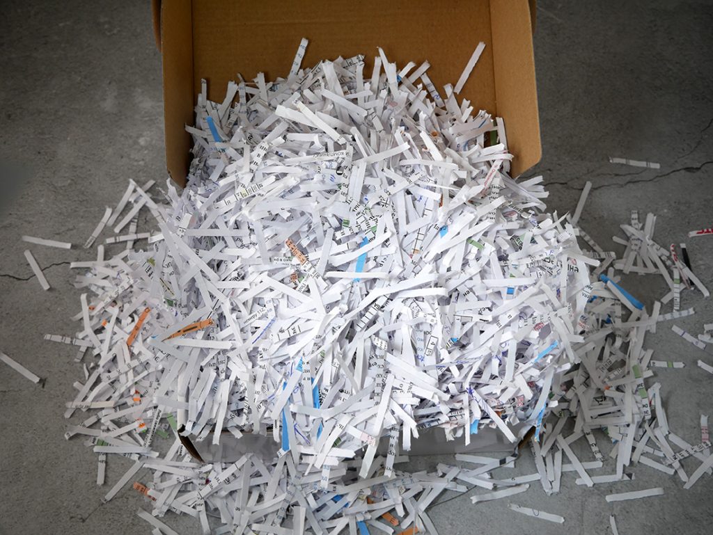 big,stack,of,shredded,documents,to,protect,confidential,information,,safety